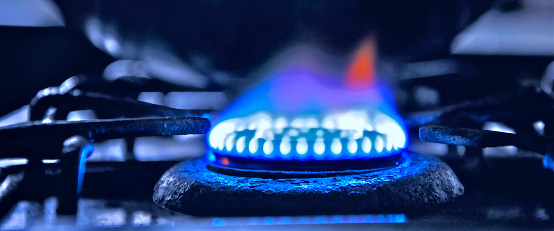 Blue gas flame on a kitchen stove